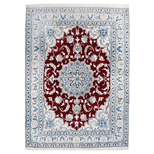 A cream and red handmade Nain wool area rug, with a floral motif design. 