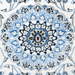 The center of a cream Nain wool area rug, with a traditional floral motif design.