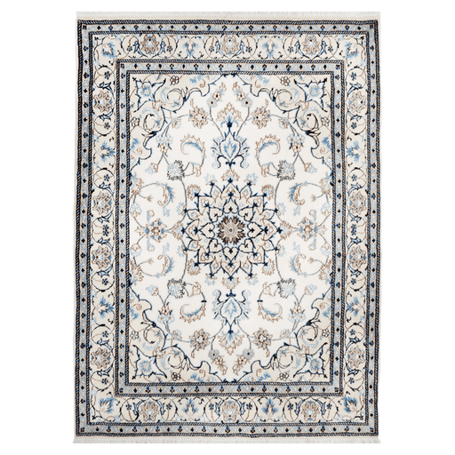 A cream handmade Nain wool area rug, with a traditional floral motif design. 