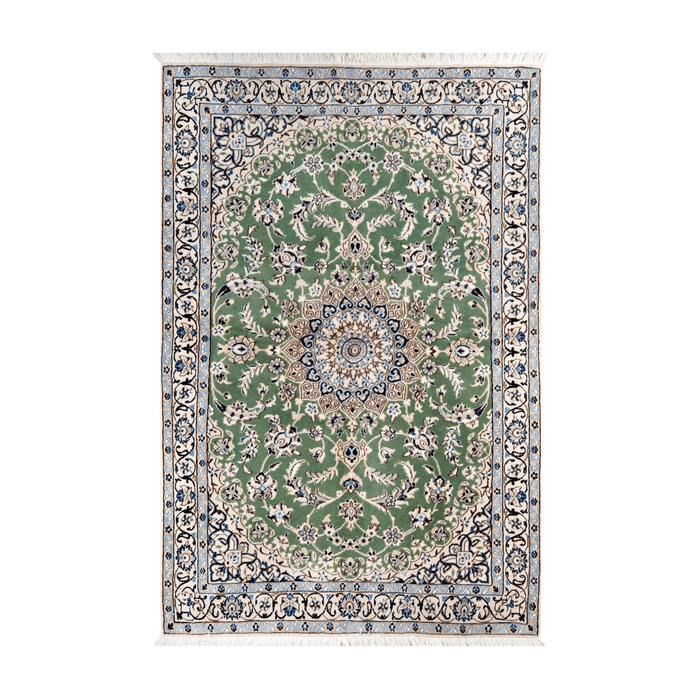 A cream and green handmade Nain wool area rug, with a floral motif design. 