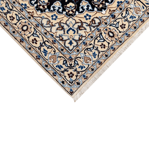 Cam Rugs: A corner of a cream base handmade Nain wool area rug, with accented black details of floral motif designs. 