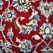 Cam Rugs: A detail of a cream base handmade Nain wool area rug, with accented red details of floral motif designs. 
