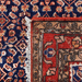 Cam Rugs: The back of a red handmade Kashkoli wool area rug, with a traditional geometric motif design. 