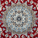 The center of a cream and red Nain wool area rug, with a traditional floral motif design.