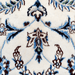 Cam Rugs: A close-up detail of a cream Nain wool area rug, with a traditional floral motif design.