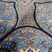 A detail of an Authentic grey Modal Silk area rug with traditional floral motif designs.