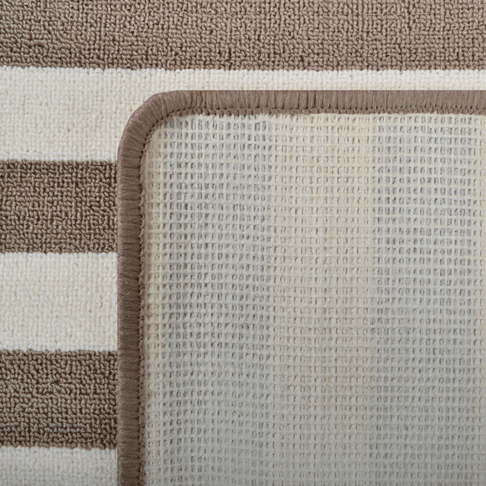 Cam Rugs: The back of a cream and beige sample area rug, with striped pattern.