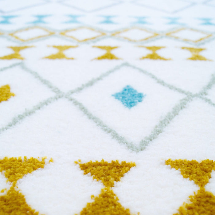 A detail of a multi-coloured area rug with geometric designs.
