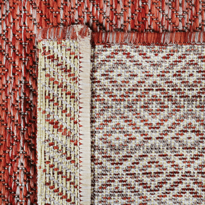 Back of a CamRugs red outdoor area rug.
