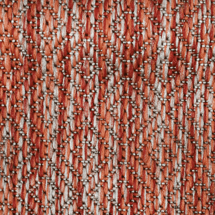 Detail of a CamRugs red outdoor area rug.