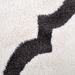 Detail of a CamRugs.Ca cream modern plush area rug.
