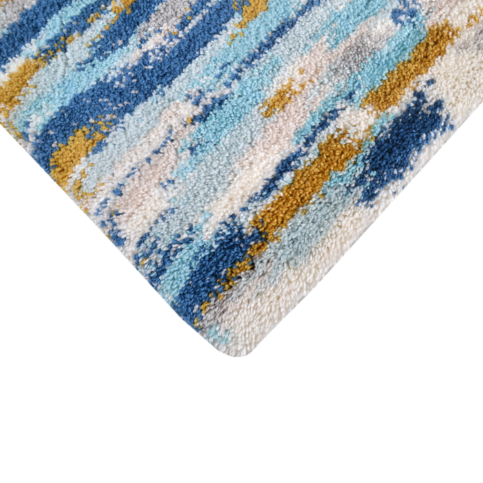 Corner of a CamRugs.Ca blue abstract shag area rug.