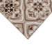Corner of a CamRugs.Ca beige geometric area rug.