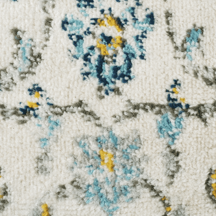 detail of a CamRugs.Ca cream distressed traditional area rug.