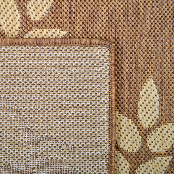 Back of a CamRugs.Ca tan floral area rug.