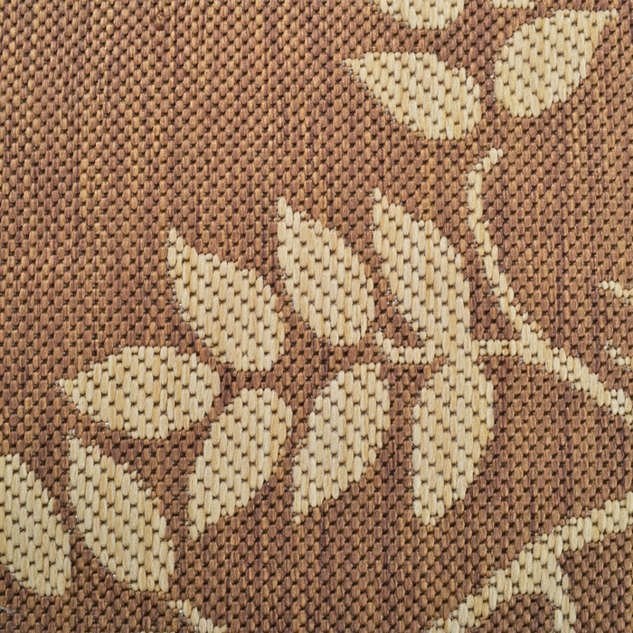 Detail of a CamRugs.Ca tan floral area rug.