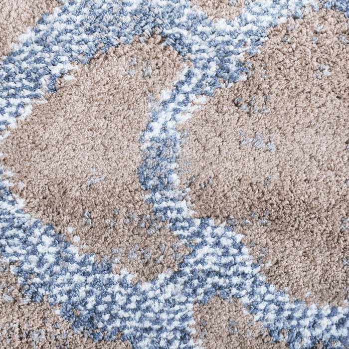 Detail of a CamRugs.Ca beige geometric area rug.