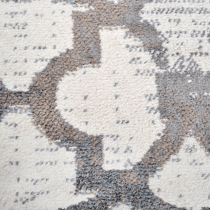 Detail of a CamRugs.Ca cream distressed traditional area rug.