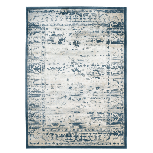 A blue and cream area rug with distressed traditional floral motif designs.