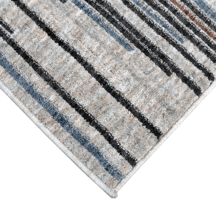 Corner of a CamRugs.Ca ivory modern area rug, made from recycled materials..