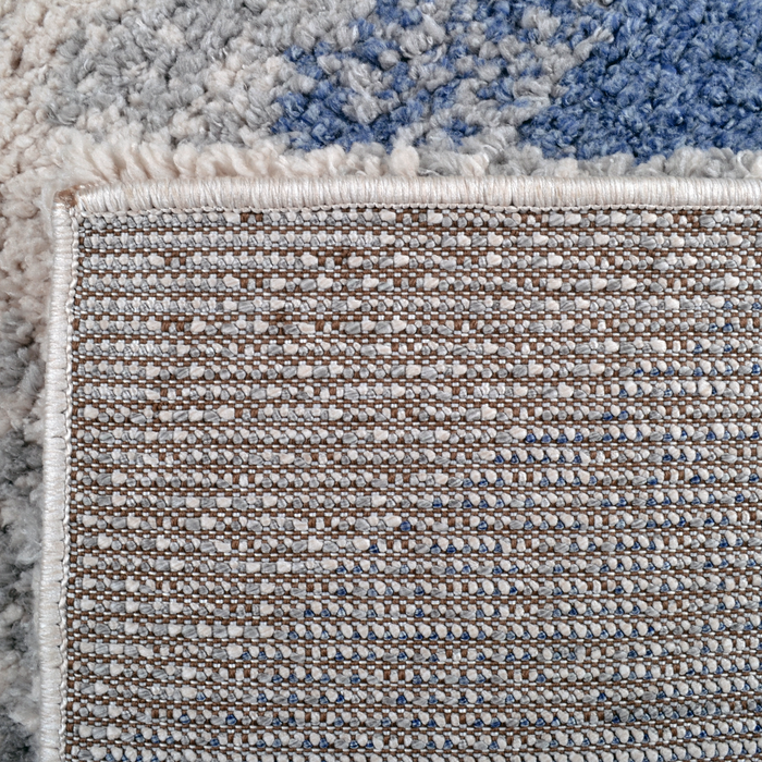 Back of a CamRugs.Ca blue modern geometric shag area rug.