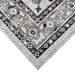 Corner of a CamRugs.Ca grey traditional area rug, made from recycled materials.