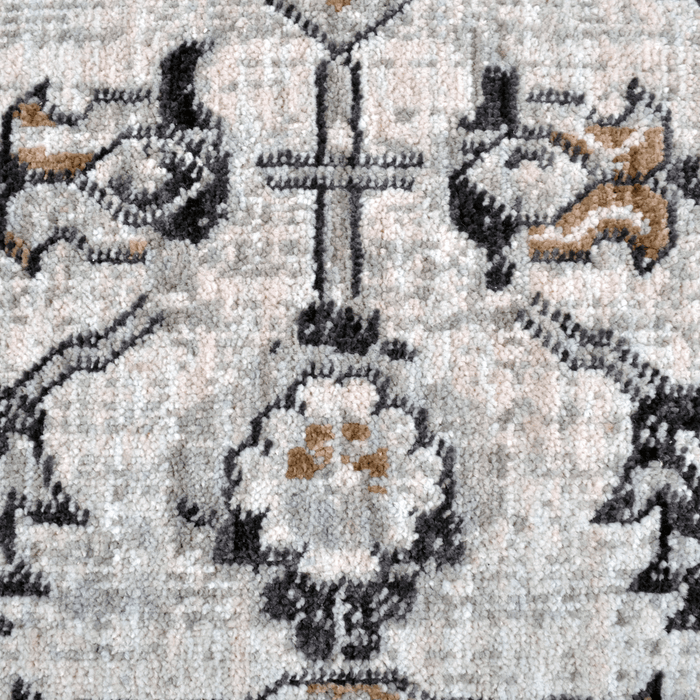 Detail of a CamRugs.Ca grey traditional area rug, made from recycled materials.