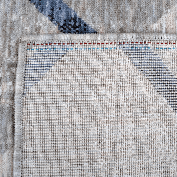 Back of a CamRugs.Ca grey modern geometric area rug, made from recycled materials.