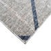 Corner of a CamRugs.Ca grey modern geometric area rug, made from recycled materials.