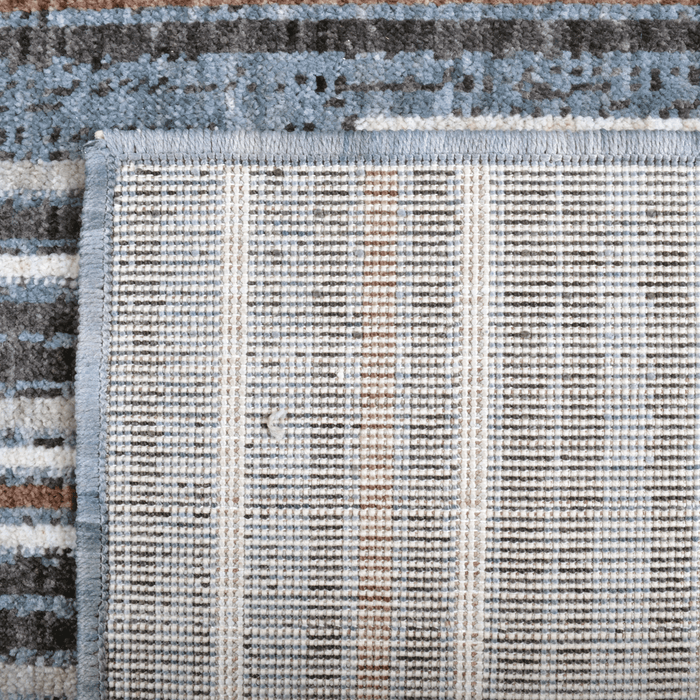 Back of a CamRugs.Ca blue modern area rug, made from recycled materials.