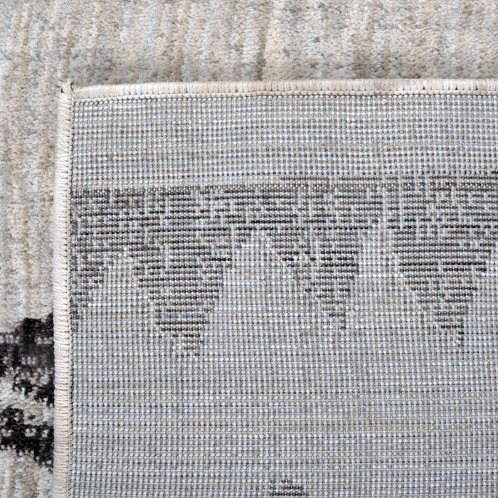 Back of a CamRugs.Ca grey geometric area rug, made from recycled materials.