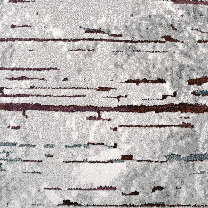 Detail of a CamRugs.Ca grey distressed abstract area rug.