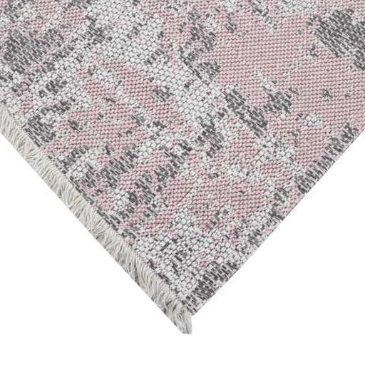 Corner of a CamRugs.Ca pink distressed abstract area rug.