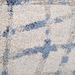 Detail of a CamRugs.Ca cream modern abstract area rug.