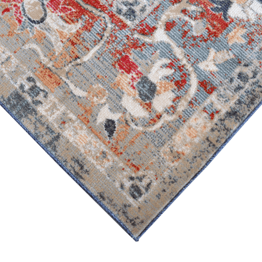 Corner of a CamRugs.Ca multi-colour distressed traditional area rug.