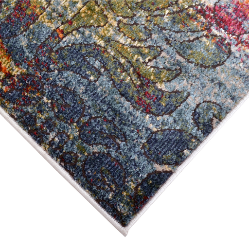 Corner of a CamRugs.Ca multi-colour distressed floral area rug.