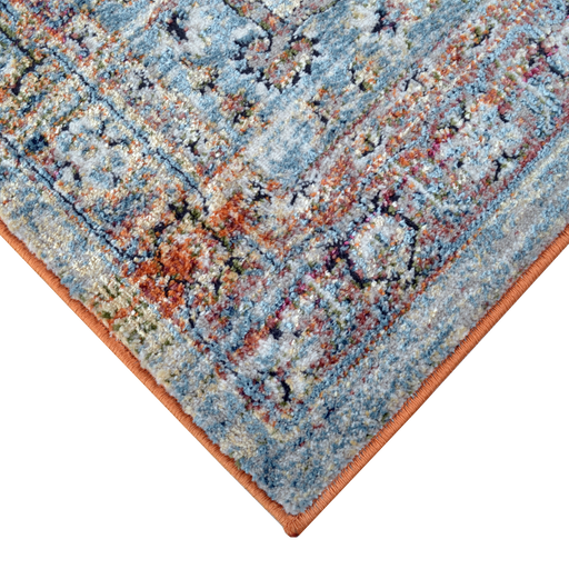 Corner of a CamRugs.Ca multi-colour distressed traditional area rug.
