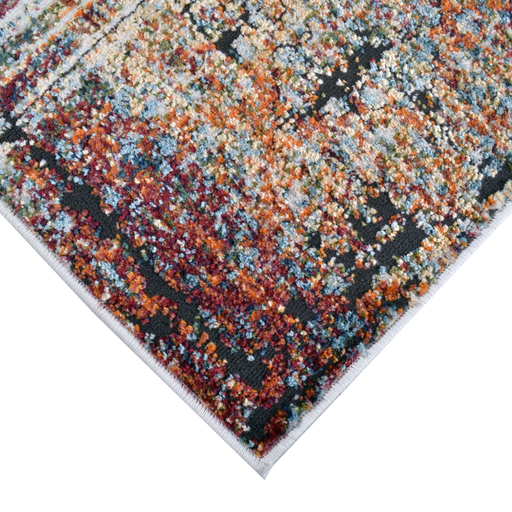 Corner of a CamRugs.Ca multi-colour distressed geometric area rug.