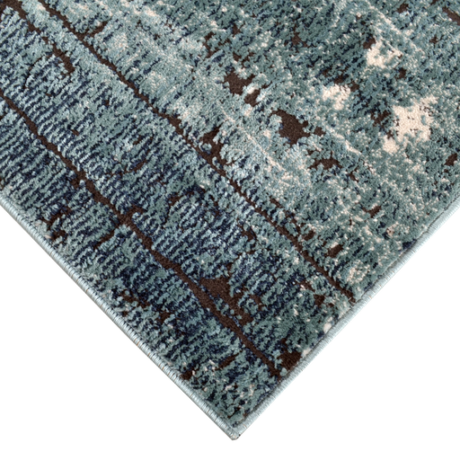 Corner of a CamRugs.Ca blue distressed abstract area rug.
