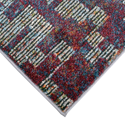 Corner of a CamRugs.Ca multi-colour distressed abstract area rug.