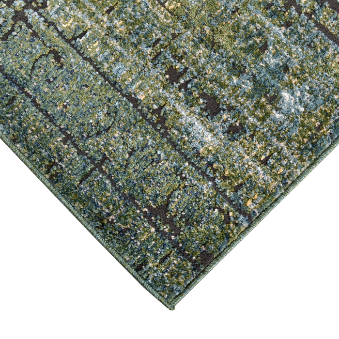 Corner of a CamRugs.Ca green distressed abstract area rug.