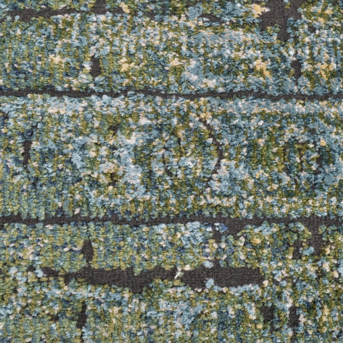 Detail of a CamRugs.Ca green distressed abstract area rug.