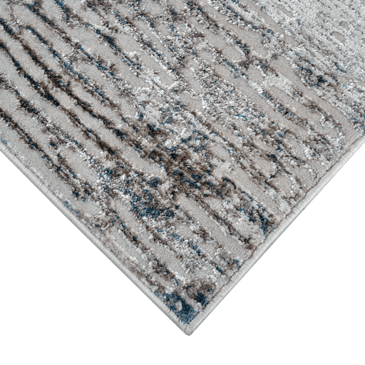 Corner of a CamRugs.Ca grey distressed abstract area rug.