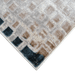 Corner of a CamRugs.Ca grey distressed geometric area rug.