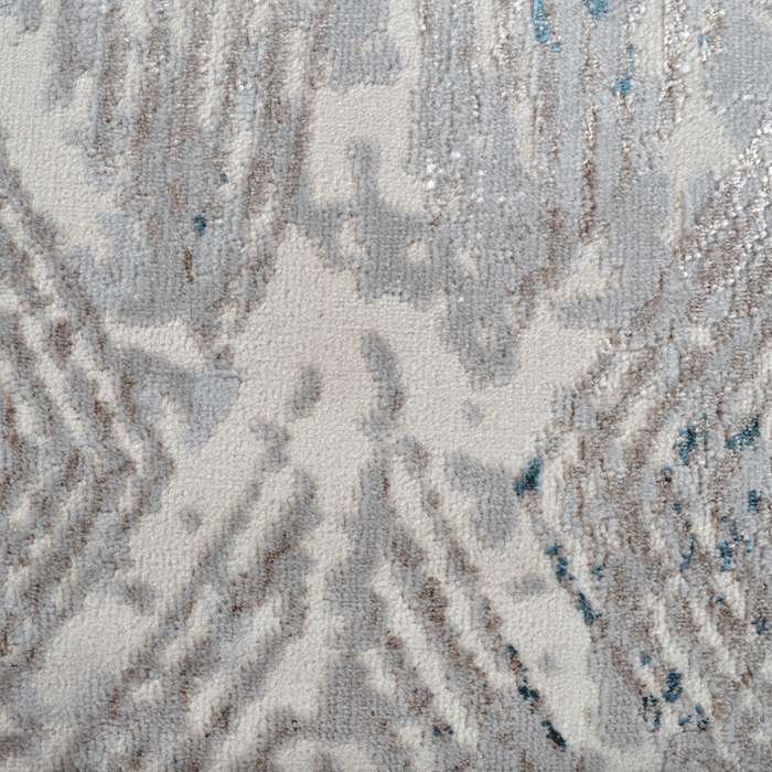 Detail of a CamRugs.Ca grey distressed geometric area rug.