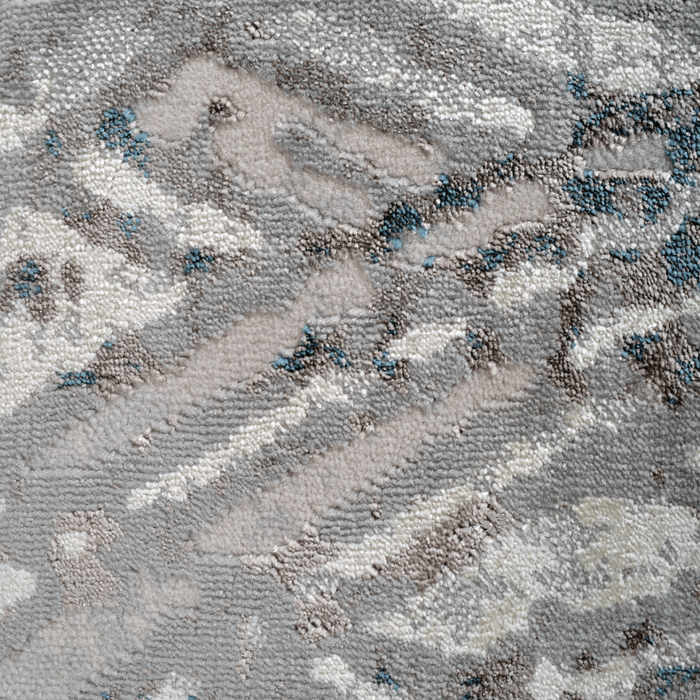 Detail of a CamRugs.Ca grey distressed geometric area rug.