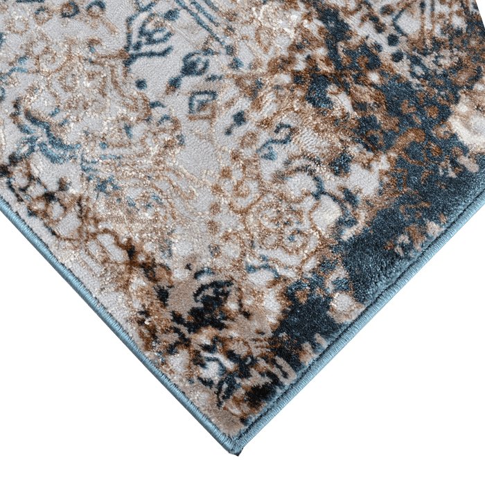 Corner of a CamRugs.Ca grey distressed traditional area rug.