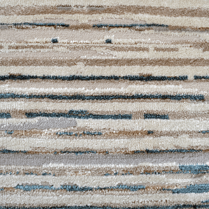 Detail of a CamRugs.Ca cream abstract geometric area rug.