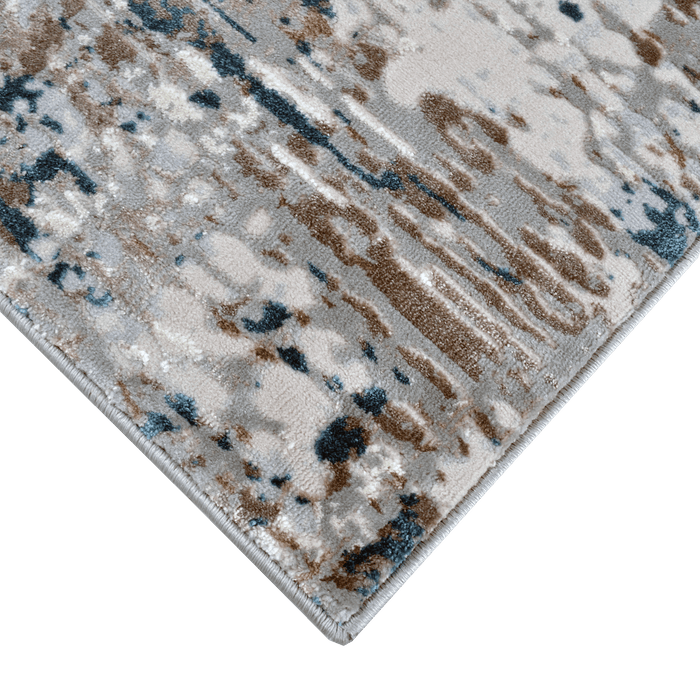 Corner of a CamRugs grey abstract area rug.