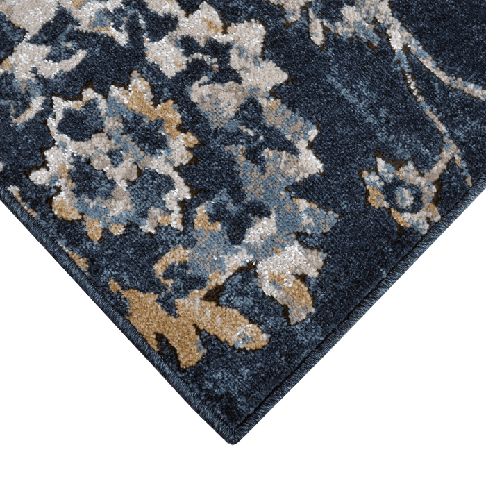 Corner of a CamRugs blue floral traditional area rug.